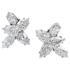 Introducing a stunning pair of diamond cluster earrings that are sure to captivate anyone's attention. These earrings feature a dazzling combination of marquise and pear-shaped diamonds that create a truly breathtaking effect. The earrings boast a total carat weight of 9.22 carats, with 4 marquise diamonds weighing 3.39 carats and 6 pear-shaped diamonds weighing 5.83 carats. While these diamonds are not certified, they are estimated to have a G-H color and VS-SI clarity, ensuring their exception Sparkly Silver Earrings, Harry Winston Diamond, Real Diamond Earrings, Titanic Jewelry, Van Cleef & Arpels, Pear Earrings, Diamond Cluster Earrings, Costume Ball, Platinum Earrings