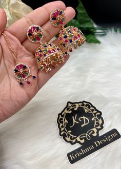 Beautiful American Diamond Jhumki Earrings with Tikka| Perfect for Wedding and Party wear occassion | High end AD earrings| gifts for her| Pink, Multi ad jhumka tikka set ⭐️Made with the Finest & High End Quality.  ⭐️ Set comes with Jhumki/Jhumka style earrings and mang tikka. Material- American Diamond Colors- -Multi - Pink High End Quality 100% Satisfaction Guarantee: Long Lasting Plating, High-Quality Stones. Perfect for any occassion-Western, Indian and Casual day looks.  Care: It is advisab Multicolor Hand Set Jhumkas For Diwali, Multicolor Hand Set Bridal Earrings For Party, Multicolor Hand-set Bridal Earrings For Party, Hand-set Multicolor Bridal Earrings For Party, Fusion Style Chandbali Jhumkas For Party, Multicolor Earrings For Navratri Celebration, Multicolor Bollywood Jhumkas Hand Set, Heavy Multicolor Jhumkas For Celebration, Hand Set Jhumkas For Diwali Celebration