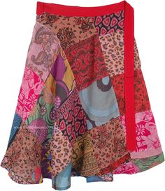 A cool summer skirt with a wrap that fits with a forever-bohemian style wrap around waist and a slight feminine flair, this is a multicolored skirt with red, orange and blue being the prominent shades.  The skirt is made up of assorted floral printed square cut patches, giving it a free-spirited gypsy look. #tlb #WrapAroundSkirt #Patchwork #JuniorPetite #Misses #Floral #Printed #Handmade Hippie Mini Wrap Skirt For Summer, Hippie Style Mini Wrap Skirt For Summer, Hippie Style Summer Mini Wrap Skirt, Multicolor Bohemian Wrap Skirt For Vacation, Bohemian Multicolor Wrap Skirt For Vacation, Bohemian Mini Wrap Skirt For Summer, Bohemian Multicolor Wrap Skirt For Beach, Multicolor Lined Wrap Skirt, Casual Multicolor Wrap Skirt For Beach