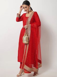 This is a beautiful 3 piece suit set. It comes with thread embellished straight cut kurta has 3/4th sleeves, round neck, calf length teamed with solid trouser pants and a net dupatta with zari & stones detailing. 3 piece set Color- Red Work- Beads & Zari Embellished Detailing Kurti Length - 46 inch Kurta Fabric-Silk Bottom Fabric - Silk Dupatta Fabric-Net with Zari & Stones Detailing Sleeves-3/4th Sleeves Neck-Round Neck Care - Dry Clean Note - The set does not include potli bag Red Kurti Outfit, Embellished Suit, Red Salwar Suit, Red Anarkali Suits, Suits For Women Indian, Red Kurti, Bridal Suits, Red Kurta, Bridal Dupatta