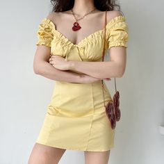 A romantic French style dress with a bustier design and playful puff sleeves. Centre-piece tie with a flattering high-waist cinch silhouette. Available in Goose Yellow. White & Black. Details: 97% Cotton / 3% Spandex Cold Hand Wash / Cool Iron Handmade pieces will take 2-4 weeks to dispatch Size / Fit: Length is measured from centre back Runs small Model wears a Small Model Info: Chest 82 cm Waist 65 cm Hips 88 cm Height 165 cm SIZE CHART Bust Waist Length Small 70 cm 62 cm 78 cm Medium 74 cm 66 Flirty Puff Sleeve Dress With Smocked Bodice For Brunch, Fitted Corset Dress With Ruched Puff Sleeves, Fitted Off-shoulder Puff Sleeve Dress For Brunch, Fitted Off-shoulder Puff Sleeve Summer Dress, Flirty Square Neck Dress With Gathered Sleeves, Flirty Puff Sleeve Dress With Sweetheart Neckline For Summer, Flirty Summer Puff Sleeve Dress With Sweetheart Neckline, Chic Puff Sleeve Corset Dress For Summer, Flirty Puff Sleeve Dress With Gathered Sleeves For Brunch