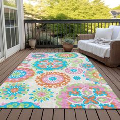 an outdoor area rug is on the deck