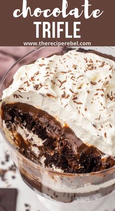 chocolate trifle in a glass dish with whipped cream and chocolate sprinkles