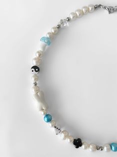 Oh, it's love. Introducing the 'CHALAMET' necklace AKA your jewelry collection's soulmate. Featuring genuine freshwater pearls strung alongside the most precious of charms, this one-of-a-kind piece will easily become a staple in your jewelry rotation. NOTE: Due to the nature of this item, some beads may vary. Made with freshwater pearls and glass, ceramic, and handmade beads. Waterproof and rust-free. Available in lengths 14", 15", 16", 18", 20". All lengths include a 2" extension chain. Handmad Boys Pearl Necklaces, Green Pearl Necklace With Colorful Beads, White Beaded Necklace With Baroque Pearl Charm, Green Pearl Necklace With Polished Beads, Beaded Baroque Pearl White Necklace, Freshwater Pearl Necklace, Creating Jewelry, Freshwater Pearl Necklaces, Glass Ceramic