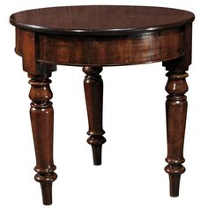 a round wooden table with two legs