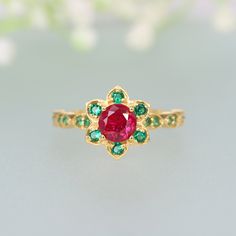 Garnet and Emerald Floral Engagement Ring January Birthstone 14K Gold Wedding Ring Multi Gemstone Cluster Ring For Women's Gift For Her Ring Description:- Main Stone- Garnet Cut of Stones - Faceted  Stone size - 5mm Stone Color- Red Stone Shape - Round Creation- Lab Created Birthstone - January Secondary Stone - Emerald ( Lab Created ) Stone Shape - Round  Stone Color - Green Stone Grade - AAA+ Check out my other items!   PAYMENTS   We accept PayPal, If we do not receive payments immediately we will hold the item only for one working day for your payments and we will be re-listing the item afterward. if there is a difficulty in paying for the item/s you have bought immediately please contact us so we can hold your item. FEEDBACK Please contact us if you have any problem with the product be Heirloom Emerald Ring With Halo Design For Wedding, Heirloom Emerald Ring With Accent Stones For Wedding, Wedding Ruby Ring In Yellow Gold With Accent Stones, Heirloom Emerald Wedding Ring With Accent Stones, Wedding Emerald Birthstone Ring, Wedding Yellow Gold Ruby Ring With Accent Stones, Gold Multi-stone Emerald Wedding Ring, Gold Multi-stone Emerald Ring For Weddings, May Birthstone Cluster Ring With Halo Design For Wedding