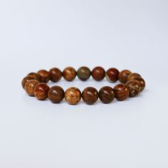 Discover the allure of our Picture Jasper Gemstone Bracelet—each bead a testament to grounding and earth's beauty. With its unique patterns and ancient wisdom, it guides you to serenity and stability through life's journey.












 

 	Crystal: Natural Picture Jasper
 	Type: Beaded Stretch Bracelet
 	Bead Size: 10 MM
 	Bracelet Size: 7 Inches
 	Wrist Size Range: 6 to 7
 	Bead Shape: Round
 	Closure: None
 	Other Materials: N/A Earthy Gemstone Beads Bracelets For Meditation, Earthy Gemstone Beaded Bracelets For Meditation, Earthy Natural Stones Bracelet For Healing, Spiritual Jasper Beaded Bracelets With Natural Stones, Jasper Bracelets For Healing With Round Beads, Earthy Jasper Gemstone Bead Bracelets, Earthy Agate Beaded Bracelet For Meditation, Healing Jasper Bracelets With Natural Stones, Earthy Jasper Gemstone Beads Bracelet