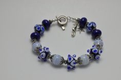 Dark Lapis & Filigree Blue Handmade by CayleeBeadedJewelry on Etsy, $60.00 Frozen Birthday Shirt, Lampwork Bracelets, Londonderry, Frozen Birthday, Sterling Silver Bracelet, Birthday Shirt, How To Make Beads, Sterling Silver Bracelets, Pandora Charm Bracelet