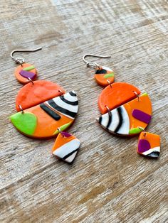 African Tribal Style Earrings Bright Neon Earrings Clay Geometric Dangle Earrings Tribal Earrings Orange One of a Kind Earrings #NickelodeonEarrings #OneOfAKindGift #ArtDecoJewelry #NeonJewelry #TribalClayEarrings #AfricanTribalGift #ModernEarrings #DropEarrings #TribalEarrings #NeonEarrings #NickelodeonGift #PolymerClayJewelry #ArtDecoEarrings #handmade #shopping #etsystore #womenwhosupportwomen #artist #Colorado #girlboss #icecreamshoes #womeninbusiness #Christmas #shoes #gifts #shopsmall #un Neon Earrings, Neon Jewelry, Ear Hangers, Earrings Clay, Art Deco Earrings, Modern Earrings, Art Deco Jewelry, Style Earrings, Polymer Clay Jewelry