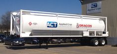 a white truck parked in front of a building