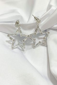 These earrings are sure to make a statement! These Baguette star earrings are so chic they will elevate any look! Trendy Star Embellished Jewelry For Parties, Star Charm Earrings For Party, Trendy Star Embellished Party Jewelry, Elegant Star Charm Earrings For Party, Elegant Party Earrings With Star Charm, Party Drop Earrings With Star Charm, Elegant Starburst Earrings For Party, Trendy Star-embellished Party Jewelry, Elegant Star-shaped Hoop Earrings For Party