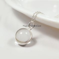 "Natural Clear Quartz Necklace, 925 Sterling Silver Jewelry, Quartz Ball Design Necklace, Minimalist Necklace, Bridesmaid Gift, Wedding Gift  : D E T A I L S : Handcrafted with lots of love ♥ and care Gemstone- Clear Quartz  Finish: Silver  Closure: Lobster clasp Measurement: Length: 17\" Extender: 2\" Pendant Size: Width: 13.2 mm, Length: 20 mm Our Jewelry is Gold polished on 925 sterling silver metal. This piece of jewelry is perfect as a gift for yourself, for a friend, a gift for Valentine's day, or a birthday. Magical Treasure Cave: Please check out the rest of our shop by clicking: https://www.etsy.com/in-en/shop/MagicalTreasureCave QUESTIONS: We are always happy to answer any of your questions, so please contact us via convo, we would love to hear from you! : C A R E : Please do not Simple Design Sterling Silver Necklace, Silver Necklace With Simple Design, Simple Sterling Silver Jewelry For Formal Occasions, Minimalist Hypoallergenic White Charm Necklace, Silver Necklace For Anniversary With Simple Design, Simple Silver Necklace For Anniversary, Silver Simple Design Anniversary Necklace, Silver Charm Necklace With Round Pendant For Wedding, Silver Round Pendant Charm Necklace For Bridesmaid