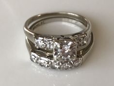 an engagement ring with three diamonds on it