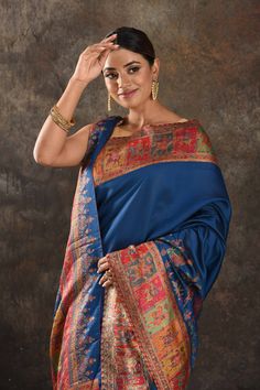 Exquisite blue Kani silk saree is one of a kind drape for a saree wardrobe! It comes with a matching blouse piece. Shop designer sarees in USA from Pure Elegance. Disclaimer: The shown stitched blouse on the model is for display purpose only. The saree comes with a matching blouse piece and finished with fall and piko. The actual product may vary slightly from the image. These are custom orders, hence expect slight variation in color, placement of the motif or buta. ESTIMATED DELIVERYBecause this is a custom order, it would take about 4 weeks from the date of purchase. RETURN POLICYThis product is a custom order and cannot be returned or exchanged. Festive Blue Tussar Silk Pre-draped Saree, Designer Blue Dupatta For Navratri, Blue Katan Silk Pre-draped Saree With Zari Work, Blue Tussar Silk Pre-draped Saree With Dupatta, Traditional Blue Pre-draped Saree With Dupatta, Blue Pre-draped Saree With Unstitched Blouse For Festivals, Blue Silk Pre-draped Saree In Traditional Style, Festive Blue Art Silk Pre-draped Saree, Blue Traditional Drape Dupatta For Designer Wear