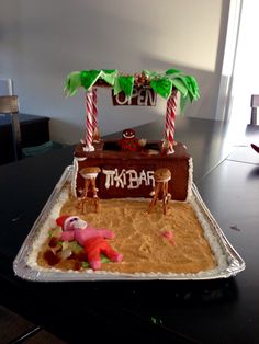 there is a cake that has been made to look like a trunk bar on the beach