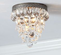 a crystal chandelier hanging from the ceiling