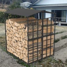 a large stack of logs sitting in front of a house