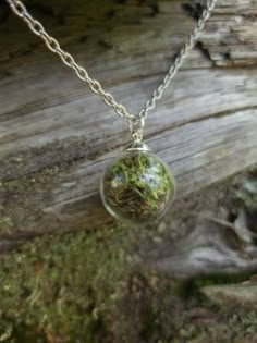 This teeny tiny round glass pendant is filled with real moss! Take a piece of the forest everywhere with you. The ball is about half an inch across. The moss is preserved so it will stay green and lush.  It comes on a nickel- free silver chain with a lobster clasp. Goblincore Necklace, Green Witch Outfit, Trinket Trading, Moss Accessories, Moss Jewelry, Moss Necklace, Forest Necklace, Forest Jewelry, Grunge Accessories