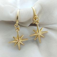 Gold Star Huggie Hoops Perfect gift, stars are universally loved.  A lovely teacher thank you gift of gifts for your bridesmaids. Modern classic small golden hoop huggie earrings.   The earring open with a simple lever. Lightweight simple design, very easy to wear everyday, you won't even feel you're wearing any. Materials Hoops are high quality gold plate over brass with a stainless steel post.  Perfect for sensitive ears.   Jewellery Care To keep your jewellery looking fabulous do not get wet, Star-shaped Single Earring As Gift, Star Shaped Single Earring As Gift, Star Shaped Single Earring For Gift, Gold Hoop Earrings With Star Charm For Gift, Gold Hoop Earrings With Star Charm As A Gift, Adjustable Star Charm Earrings For Gift, Handmade Star-shaped Earrings For Gift, Star-shaped Hoop Earrings For Gift, Star Shaped Hoop Earrings Gift