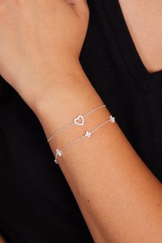 Show your love with the Sterling Silver Heart Bracelet, a beautifully crafted, minimalist piece that exudes elegance and charm. Perfect as a gift for her, whether it's for a girlfriend, a close friend, or a loved one, this bracelet features a delicate heart charm that symbolizes affection and connection. Its sleek sterling silver chain and dainty flower accents make it an ideal accessory for everyday wear or special occasions. This bracelet is the perfect balance of subtlety and sophistication, making it a meaningful gift that will be cherished for years to come. Finding the perfect fit is a breeze! Our bracelets are designed to be adjustable approx. 1 inches, so everyone can feel comfy and confident. For example: if you order 6 inches, you will be able to use your braceelt up to 7 inches. Heart Bracelets, Sterling Silver Heart Bracelet, Silver Heart Bracelet, Bracelet Heart, Bracelet Minimalist, Bracelet Dainty, Wedding Jewelry Bracelets, Dainty Bracelets, Bracelets For Women