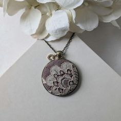 This antique lace necklace is the perfect gift for those that love a timeless and elegant style. The beige floral lace is a beautifully preserved piece from the 1920s, making it a genuine antique at almost 100 years old. A classic dark shade of burgundy cotton fabric is behind the lace, and it's set in an antique bronze color pendant that adds to the vintage feel. Letter charm: The finishing touch is the capital letter initial charm at the top of the pendant. This charm offers the perfect way to make this necklace a thoughtful and personalized gift. Chain: See the photos for popular chain length examples, or leave me a note at checkout for any custom length. Come see the rest of my unique, handmade lace jewelry in my shop: https://www.etsy.com/shop/TheWhirlwind Shipping: All orders ship as Elegant Beige Necklaces For Wedding, Elegant Beige Necklace For Wedding, Delicate Cream Jewelry As A Gift, Delicate Cream Jewelry For Gift, Adjustable Cream Necklace For Wedding, Elegant Handmade Lace For Wedding, White Filigree Necklace For Wedding, Delicate Cream Necklace For Gift, Vintage Beige Necklace For Gift