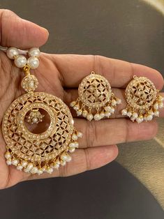 Featuring a traditionally designed pearl pendant set in 925 sterling silver & 22k gold plating. It has been set with freshwater pearls. These evergreen designs never go out of style. Its made by Our expert Amritsari Artisans Made In India / Amritsar-Punjabi Style Jadau Sets Option 1 ) Pearl Design SILVER Weight : 40.650 GMs Pendant Dimensions: 3 x 2 inches Earrings Dimensions: 2 x 1 inches Price: Amritsari Jadau Jewellery, Traditional Pearl Pendant Jewelry, 22k Gold Pearl Earrings For Festivals, Festive Gold Pearl Necklace With Pearl Pendant, 22k Gold Pearl Necklace For Celebrations And Festivals, Festive Gold Pearl Necklace With Charm, Gold Meenakari Round Pendant Jewelry, Festive Pearl Chandbalis With Pearl Drop, Gold Plated Temple Jewelry Pearl Necklace For Celebration