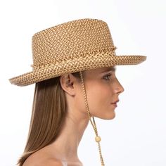 Tucson is a designer woman's sunhat for sale made of Squishee®. The modified Western shape has a fringe edged band and a self bolo braid chin strap with a wood bead to adjust and secure it. The signature logo rivet is discretely placed at the back of the crown. The wired brim permits shaping; push up the sides for more Western flare, or flatten them out for additional shade. Squishee® is a man-made material incorporating recycled fibers. It looks and feels just like natural raffia but has the ad Hat Western, Art Costume, Women's Headwear, Costume Institute, A Wood, Signature Logo, Vanity Fair, The Crown, Tucson