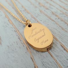 Keep the memory of a loved one forever by having their hand writing engraved on a keepsake urn necklace. I can engrave both sides of this beautiful oval urn, with either your handwriting sample or your favorite font. A gold stainless steel engraved oval capsule with a secret - perfect to hold the cremation ash remains of your loved one close at all times.  The top can unscrew to reveal a secret cavity. Just send me a message with an image of the hand writing attached and I will convert it into a vector image for engraving. This pendant measures: 20 mm x 30 mm I have suspended this pendant from a matching chain, please choose your desired chain length upon checkout.  Need to secure the top permanently? A little loctite from your local hardware store can be applied to the area where you scre Engraved Dog Tag Necklace For Keepsake, Keepsake Engraved Oval Link Necklace, Engraved Oval Link Necklace For Keepsake, Oval Etched Necklace For Anniversary, Oval Engraved Locket Necklace For Memorial, Engraved Oval Pendant Locket Necklace For Gifts, Engraved Oval Pendant Locket Necklace As Gift, Personalized Oval Pendant Locket Necklace For Memorials, Engraved Oval Pendant Locket Necklace