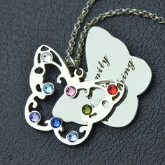 Celebrate your love for mom with this gorgeous sterling silver family butterfly birthstone necklace. The shape of butterfly is the symbol of change, this makes an especially memorable gift for a new mom or grandma. Mother's Day Butterfly Charm Pendant Necklace, Mother's Day Butterfly Pendant Necklace, Butterfly Shape Birthstone Jewelry For Anniversary, Butterfly Shaped Birthstone Jewelry For Anniversary, Stainless Steel Butterfly Necklace Gift, Mother's Day Butterfly Jewelry With Butterfly Charm, Mother's Day Jewelry With Butterfly Charm, Mother's Day Butterfly Charm Jewelry, Mother's Day Anniversary Necklace With Butterfly Charm