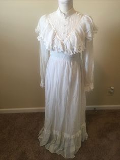 Gunne Sax Size 7 Lace Vintage Hippie Boho Dress Wedding Dress. Sleeve Length 24.5”. Dress Is In Excellent Condition. Looks Like Makeup On Collar Selling As Found Please See All Pictures For Part Of The Description. (MM) 1970s Style Spring Wedding Dress, 1970s Style Wedding Dresses For Spring, Classic White Floor-length Dress, Fitted Victorian Prairie Dress For Wedding, Fitted White Victorian Dress, White Lace Prairie Dress For Wedding, Vintage Floor-length Wedding Dress, White Lace Prairie Wedding Dress, Vintage White Prairie Dress With Lace Trim For Wedding