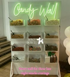 the candy wall is filled with sweets for those late night snacks