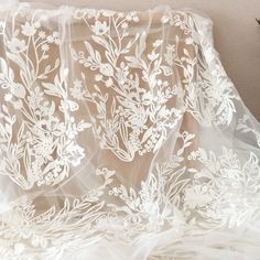 1 Yard Wedding Lace Tulle Embroidery Floral Off-White Drape Lace Fabric for Bridal Gown Dress Train Wedding Veils * Width is about 140cm , price is for one yard, more buying will be cut as one piece . * Gorgeous for wedding gown, haute coutures design, or lace veils , flower girl clothes my shop link: http://www.etsy.com/shop/lacetime ------------------------------------------------------ ---------------------------------------------------------------- ------------------------------------------- Wedding Gown With Floral Embroidery And Tulle Material, Floral Embroidered Tulle Gown For Wedding, Floral Applique Organza Gown For Wedding, Organza Wedding Gown With Floral Embroidery, Wedding Gown With Floral Embroidery In Organza, Wedding Organza Gown With Floral Embroidery, Organza Gown With Floral Applique For Wedding, Floral Embroidered Organza Wedding Dress, Embroidered Organza Wedding Dress