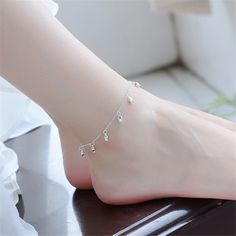 Show off your pedicure and add touch of light-catching shine to your ensemble with this elegant anklet plated in gleaming sterling silver. 0.35'' W x 9.84'' L S-hook clasp Fine silver-plated copper Sterling Silver Anklets, Elegant Anklet, Jewelry Bride, Charm Anklet, Silver Anklet, Cute Rose, Rose Bracelet, Silver Bracelets For Women, Sterling Silver Anklet