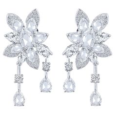 A beautiful arrangement of brilliant and rose cut diamonds come together to create these drop earrings which is a part of our Cascade collection. Studded with 44 round, 6 pear and 16 rose cut pear diamonds. Inspired by the beauty of the naturally flowing waterfall, these dangling earrings from our Cascade Collection are crafted in 18 KT white gold and can be secured comfortably with omega and guardian post. Drawing from a century of expertise in the diamond and jewelry industry, HARAKH was launc Art Jewelry Design, Colorless Diamond, Luxury Jewellery, Fabulous Jewelry, Pear Diamond, Dangling Earrings, Van Cleef Arpels, Rose Cut Diamond, Diamond Jewellery