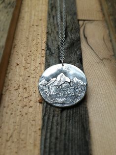 "Each pendant is hand crafted from substantial pieces of sterling silver. The texture is unique in each and every necklace. It will look a lot like the image above, but not exactly. This piece was inspired by mountain biking in California in the Sierra Nevada Mountain Range. Absolutely beautiful! If you're interested in your necklace having a particular Mountain Range, let me know! They're all made custom. The pendant dangles from a durable lovely rolo chain and lobster claw closure and can be m Mt Whitney, Nature Necklace, Rolo Chain, Mountain Range, Metal Stamping, Nevada, Favorite Jewelry, Arrow Necklace, Let Me