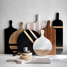 cutting boards and cheese board are arranged on the table