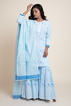 Aqua blue cotton cambric printed kurta in floral foil and bird motifs. Paired with a printed gharara and dupatta.
Component: 3
Pattern: Printed
Type Of Work: Bird, Floral, Geometric, Foil print
Neckline: Round
Sleeve Type: Three quarter
Fabric: Cotton cambric, Mulmul
Color: Blue
Other Details: 
Lace work detail
Side tassel gharara
Occasion: Mehendi - Aza Fashions Printed Gharara, Bird Motif, Women Kurta, Straight Kurta, Floral Geometric, Foil Print, Set For Women, Aza Fashion, Aqua Blue