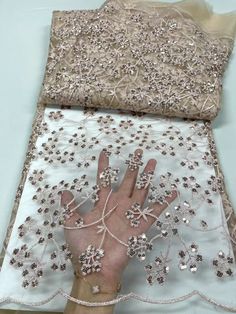 Migliora il tuo stile personale con la nostra splendida collezione di tessuti con paillettes. Sperimenta l'arte di creare capi e accessori unici che riflettono la tua individualità. Il nostro tessuto con perline glitterate ricamate con paillettes irradia un'incantevole brillantezza, ornato con squisiti elementi decorativi come paillettes, paillettes e lustrini. Realizzato meticolosamente per individui alla moda, questo tessuto incarna l'eleganza e il glamour, dandoti la possibilità di trasformare i tuoi sogni di moda in realtà. Migliora il tuo guardaroba e abbraccia il fascino del nostro tessuto con paillettes: una scelta perfetta per chi cerca una dichiarazione di stile. Venduto con incrementi di 5 iarde: ogni borsa include 5 iarde.


 100% poliestere

 Larghezza: 51/52"

 Utilizzo: abbig Elegant 3d Embroidered Fabric For Party, Embellished Sequin Dress For Wedding And Party Season, Glamorous Embroidered Sequin Fabric For Wedding, Embellished Sequin Fabric For Party Celebrations, Fitted Embellished Embroidered Fabric For Banquet, Embroidered Fitted Sequin Fabric For Banquets, Elegant Embroidered Fabric With Sequins For Banquets, Glamorous Embroidered Sequin Fabric For Celebration, Elegant Embroidered Fabric With Sequins For Banquet