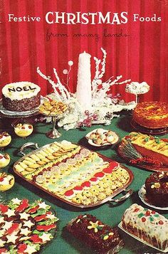 a table topped with lots of cakes and desserts