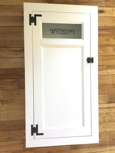 a white door with the words apothecary on it