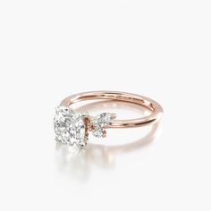 a rose gold engagement ring with two diamonds