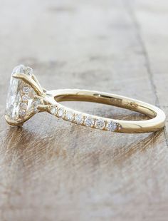 an engagement ring with a pear shaped diamond in the center