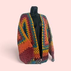 Custom rainbow Granny square cardigan. Available in custom colors Colorful One Size Fall Cardigan, Colorful One Size Cardigan For Fall, Multicolor Open Front Fall Sweater, Multicolor Open Front Sweater For Fall, Trendy Multicolor Open Front Cardigan, Multicolor Retro Knitted Outerwear, Multicolor Long Sleeve Knit Cardigan, Multicolor Knit Cardigan One Size, One Size Multicolor Knit Cardigan