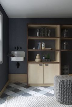 a living room filled with furniture next to a window