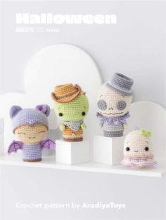 three crocheted dolls are sitting on a shelf with the words halloween written below them