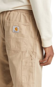 Made from durable organic-cotton twill, these straight-leg pants with an elastic waist are sure to be your everyday go-to. 29 1/2" inseam; 15" leg opening; 15" front rise; 16 1/2" back rise (size Medium) Elastic waist Front slant pockets; back patch pockets 100% organic cotton Dry clean or machine wash, tumble dry Imported Carhartt Men, Mens Hiking Pants, Men’s Cargo Pants Styles, Carhartt Pants Outfit, Mens Cuffed Pants, Carhartt Mens Fashion, Carhartt Mens Pants, Carhartt Newel Pant, Carhartt Style