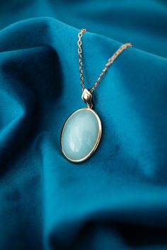 Vintage 9ct Yellow Gold Teal Chalcedony Enhancer Pendant. Metal: 9ct Yellow Gold   Stone: Chalcedony   Size: 20.5mm x 30mm     Price: $725.00     007-00036     Please view all photos as they form part of the description.   This item will be presented in one of our gorgeous boxes and carefully packaged should you wish to have it posted to you. Exquisite Oval Cabochon Yellow Gold Jewelry, Classic Polished Jade Jewelry, Classic Jade Jewelry, Elegant Jade Necklace For Formal Occasions, Yellow Gold Jade Jewelry With Cabochon, Oval Jade Cabochon Necklace, Oval Jade Cabochon Necklaces, Oval 14k Gold High Luster Jewelry, Elegant Jade Cabochon Necklace