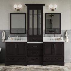 a bathroom with two sinks and mirrors on the wall