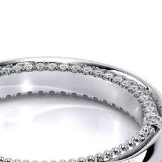 Verragio Women's Diamond Wedding Band Matching Engagement Ring: VENETIAN-5070D-2RW VENETIAN-5070R VENETIAN-5070P VENETIAN-5070OV Collection: VENETIAN Style Number: VENETIAN-5070W VENETIAN-5070W from the Venetian Collection, features a gorgeous straight band adorned with round brilliant diamonds. Additionally, a sparkling half diamond Riviera on the inside compliments your matching engagement ring. Complete your bridal look by ordering your set today. Starting Price: $4,250.00 USD* Carat Weight: Luxury Wedding Halo Setting Jewelry, Luxury Wedding Halo Design Ring, Luxury Rings For Marriage, Luxury Bridal Sets With Diamond Accents, Round Shape, Luxury Diamond Bridal Sets With Brilliant Cut, Platinum Wedding Ring With Halo In Diamond White, Formal Platinum Wedding Rings With Pave Setting, Luxury Moissanite Wedding Ring, Luxury White Gold Halo Diamond Ring