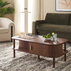 a living room with a couch, coffee table and chess set on top of it